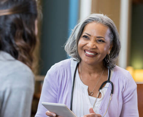 female medical provider talking with patient